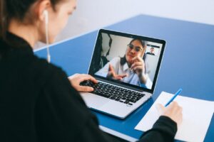 Woman at desk with laptop, ABA therapy